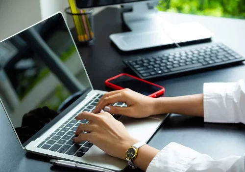 female-hand-typing-keyboard-laptop